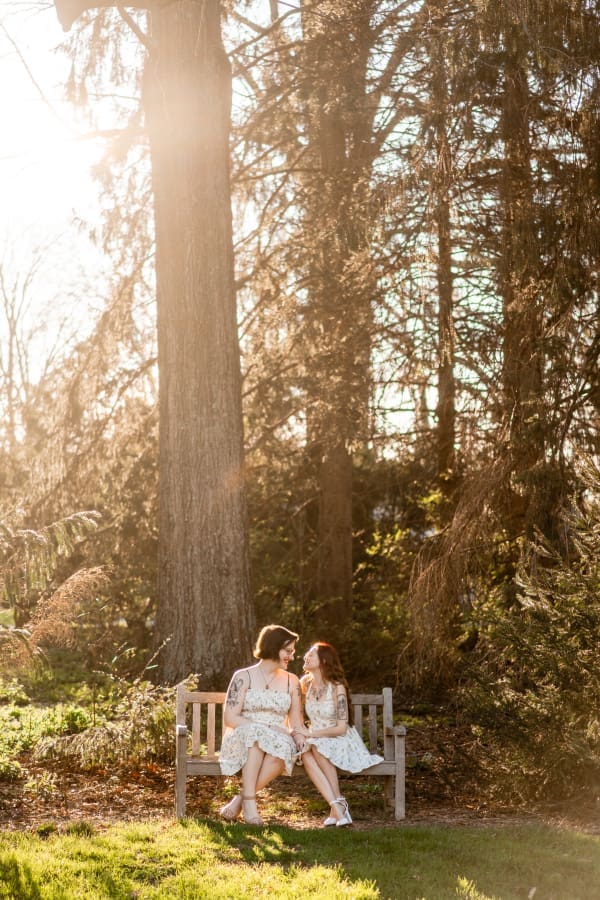 A LGBTQ+ couple sitting on a bench at Inniswoods Metro Gardens