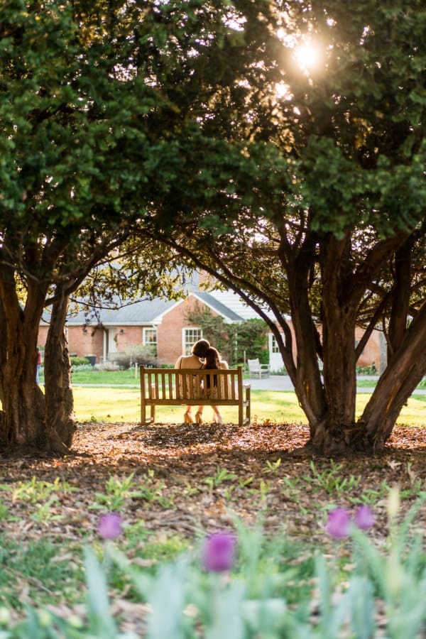 An artistic engagement photo of a LGBTQ+ couple at Inniswoods Metro Gardens
