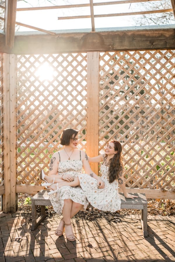 A golden hour engagement photo of a LGBTQ+ couple at Inniswoods Metro Gardens