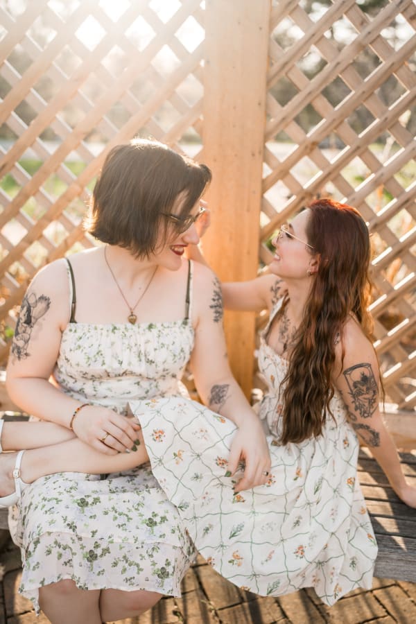 A golden hour engagement photo of a LGBTQ+ couple at Inniswoods Metro Gardens