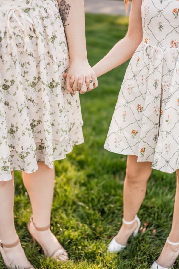Two women holding hands at Inniswoods Metro Gardens