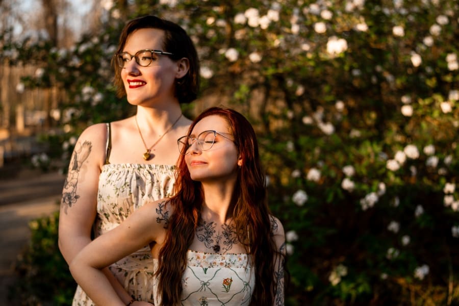 A golden hour engagement photo of a LGBTQ+ couple at Inniswoods Metro Gardens