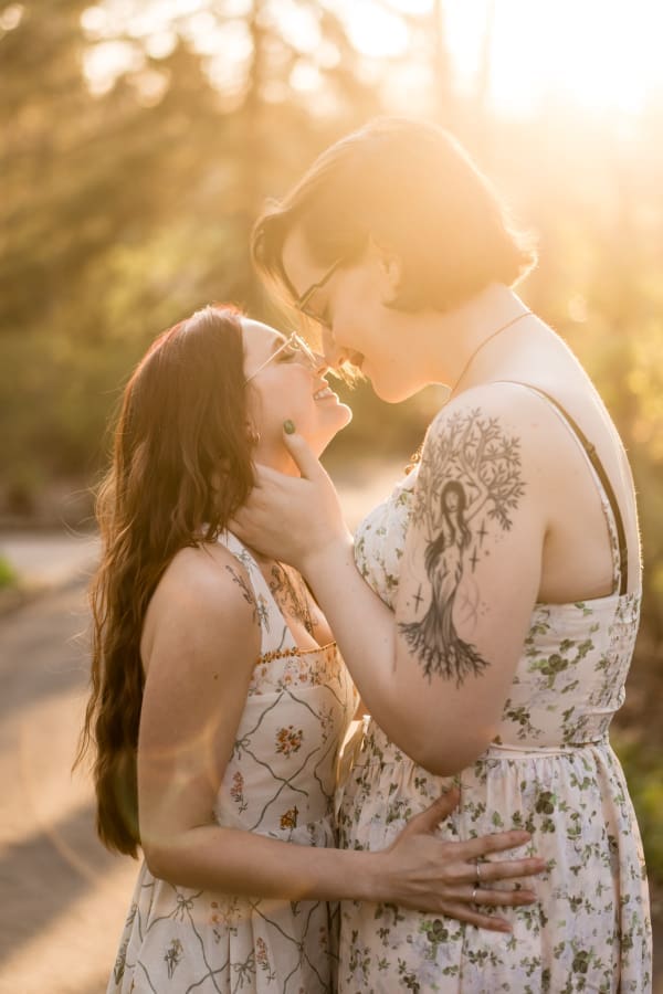A golden hour engagement photo of a LGBTQ+ couple at Inniswoods Metro Gardens