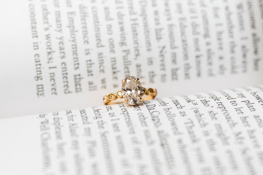 Engagement ring sitting in a book