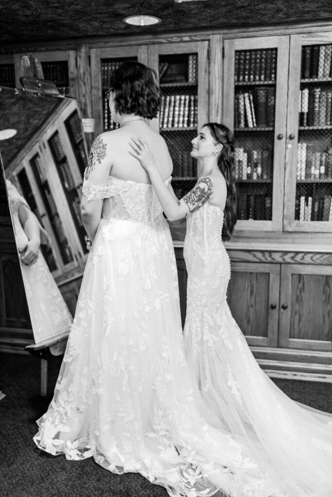 Two brides getting ready at a Columbus Ohio LGBTQ+ wedding at Wagnalls Memorial Library