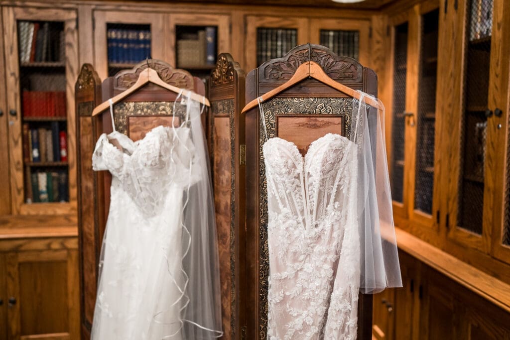 Two wedding dresses hanging at Wagnalls Memorial Library