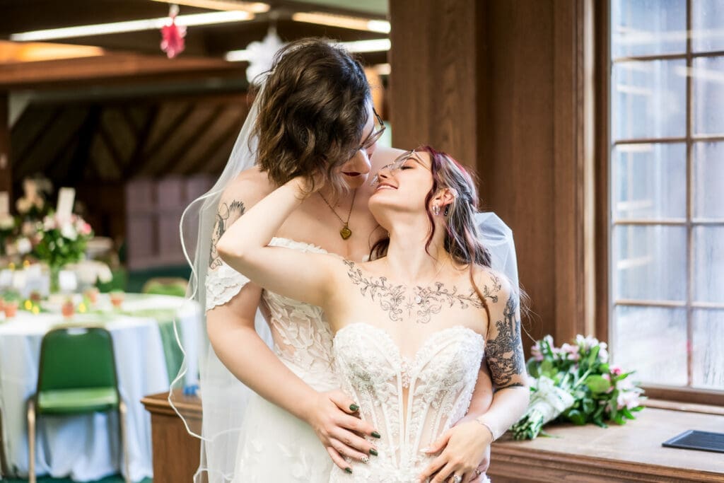 Couple portrait of two brides at a Columbus Ohio LGBTQ+ wedding at Wagnalls Memorial Library