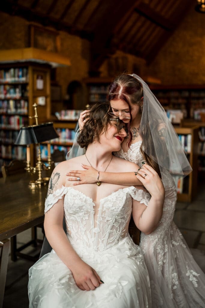 Couple portrait of two brides at a Columbus Ohio LGBTQ+ wedding at Wagnalls Memorial Library