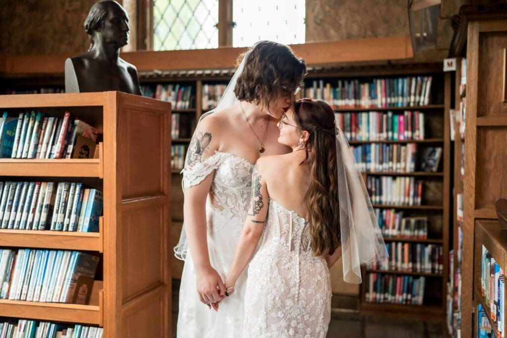 Couple portrait of two brides at a Columbus Ohio LGBTQ+ wedding at Wagnalls Memorial Library