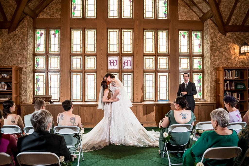 The first kiss at a Columbus Ohio LGBTQ+ wedding at Wagnalls Memorial Library