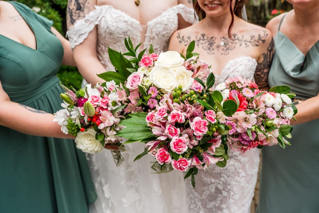 Pink and green bouquets at a Columbus Ohio LGBTQ+ wedding at Wagnalls Memorial Library