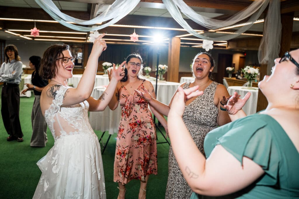 Candid moment at a Columbus Ohio LGBTQ+ wedding at Wagnalls Memorial Library