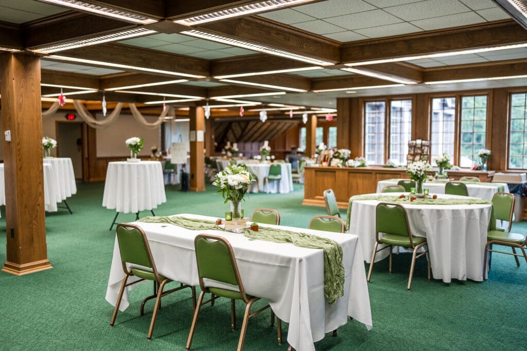 Reception whimsical garden decor at a LGBTQ+ wedding at Wagnalls Memorial Library