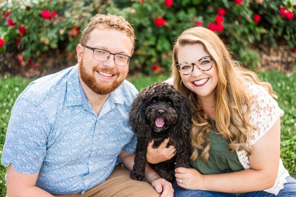 Engagement photos at the Columbus Park of Roses with their dog.