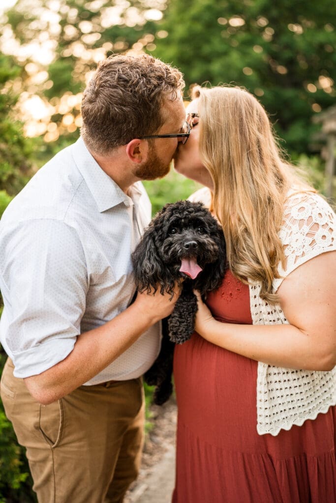 Golden hour engagement photos at the Columbus Park of Roses with their dog.