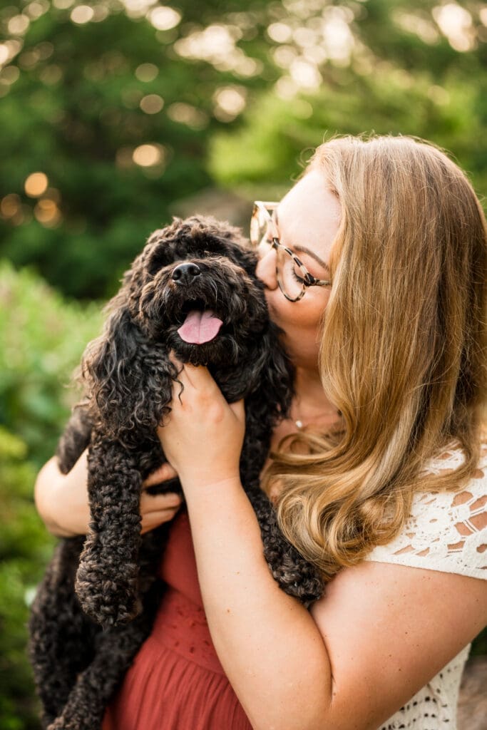 Golden hour engagement photos at the Columbus Park of Roses with their dog.