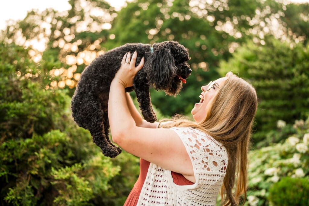 Golden hour engagement photos at the Columbus Park of Roses with their dog.