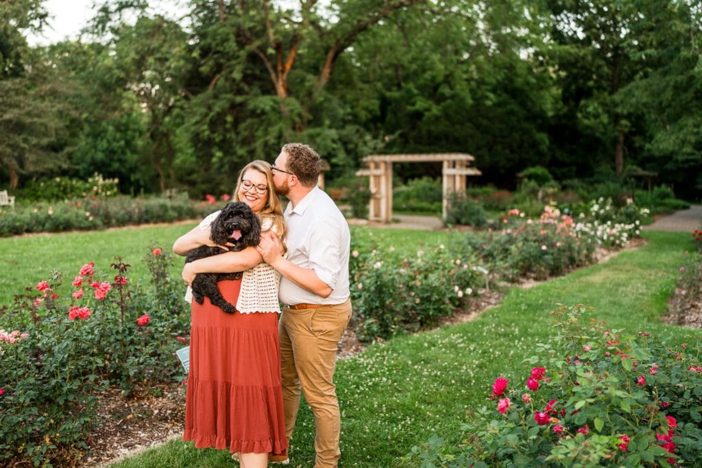 Engagement photos at the Columbus Park of Roses with their dog.