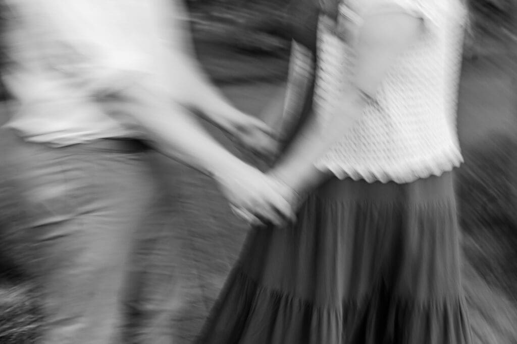 Blurry engagement photos at the Columbus Park of Roses.