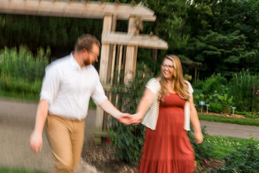 Blurry engagement photos at the Columbus Park of Roses.