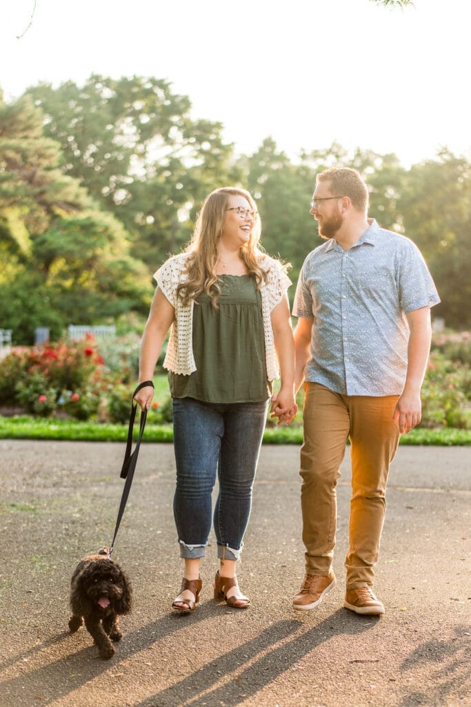 Golden hour engagement photos at the Columbus Park of Roses with their dog.