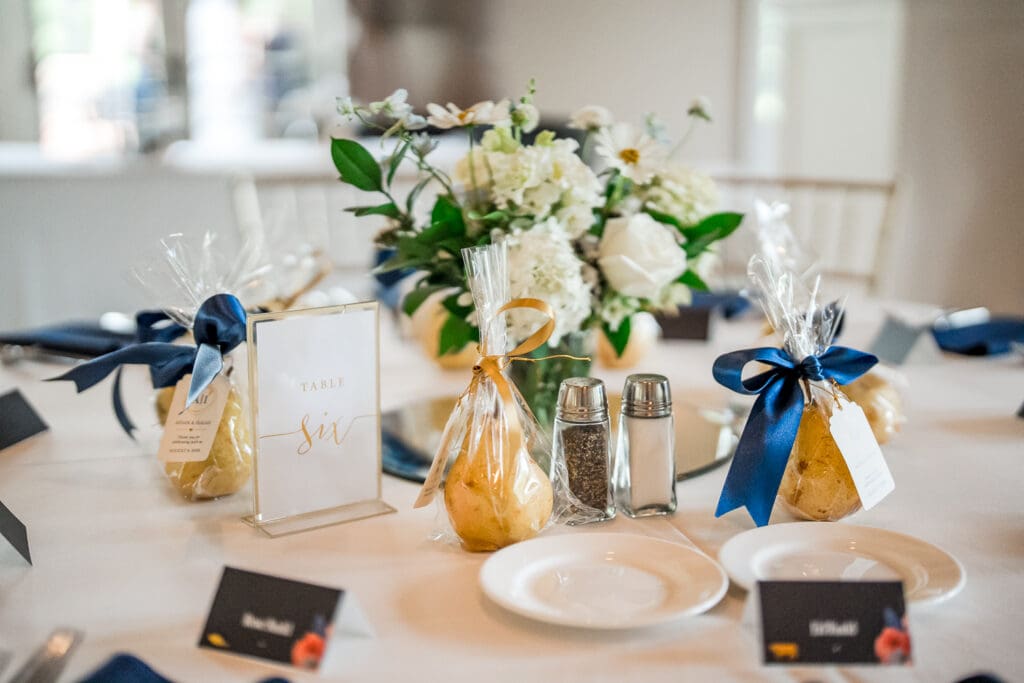 Navy and gold reception table details at a wedding a Pinnacle Golf Course in Grove City, Ohio.