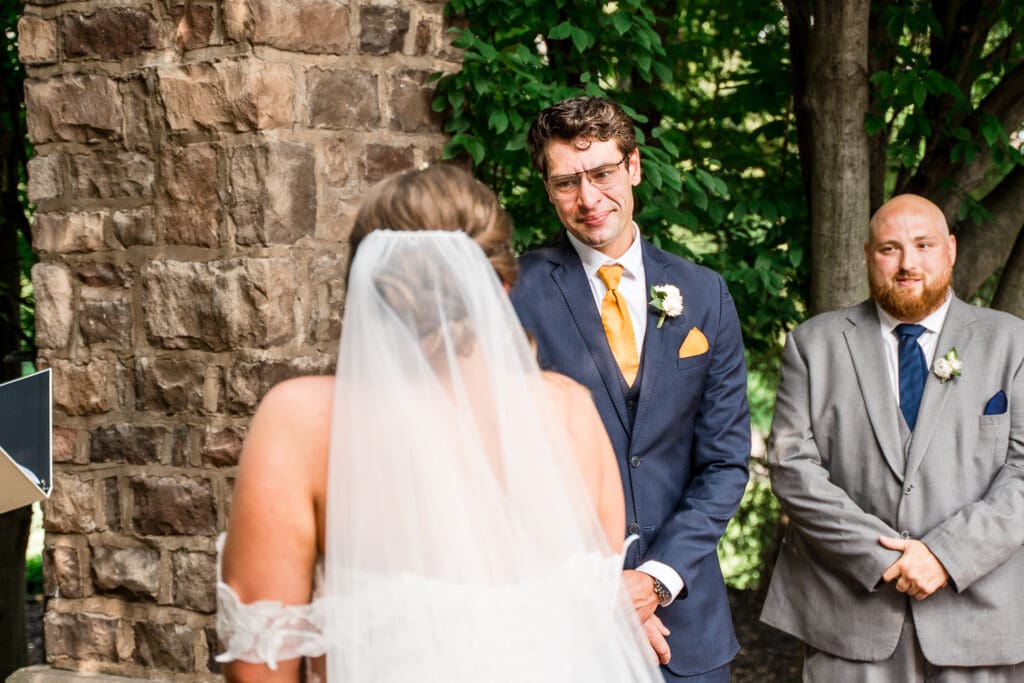 Groom reaction at their wedding ceremony at Pinnacle Golf Club in Grove City, Ohio.