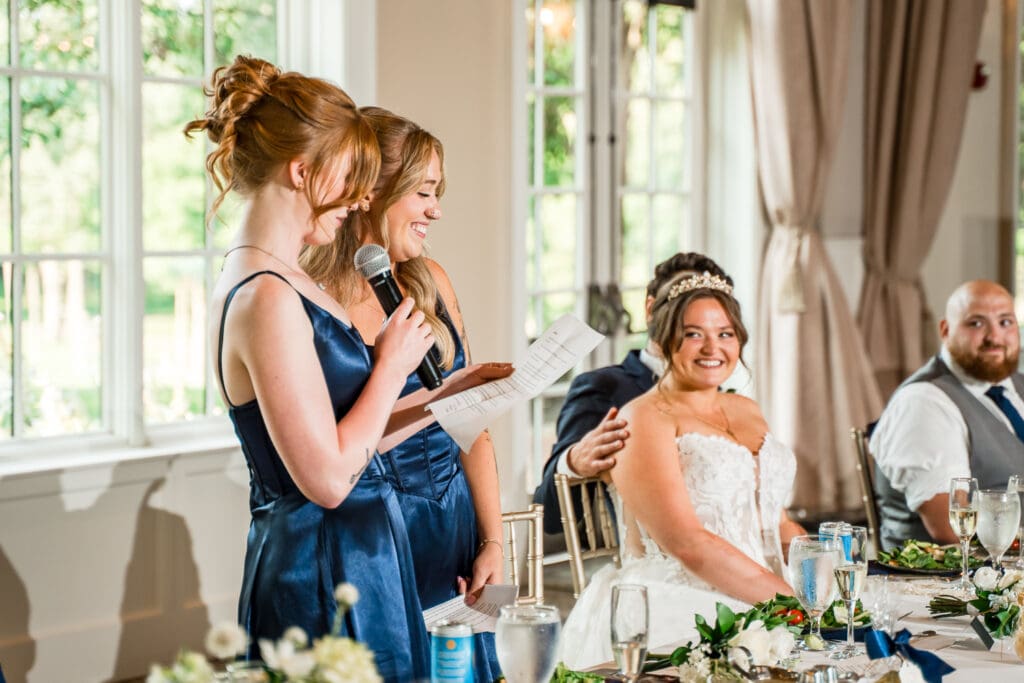Toasts at a navy and gold themed wedding at Pinnacle Golf Club in Grove City, Ohio.